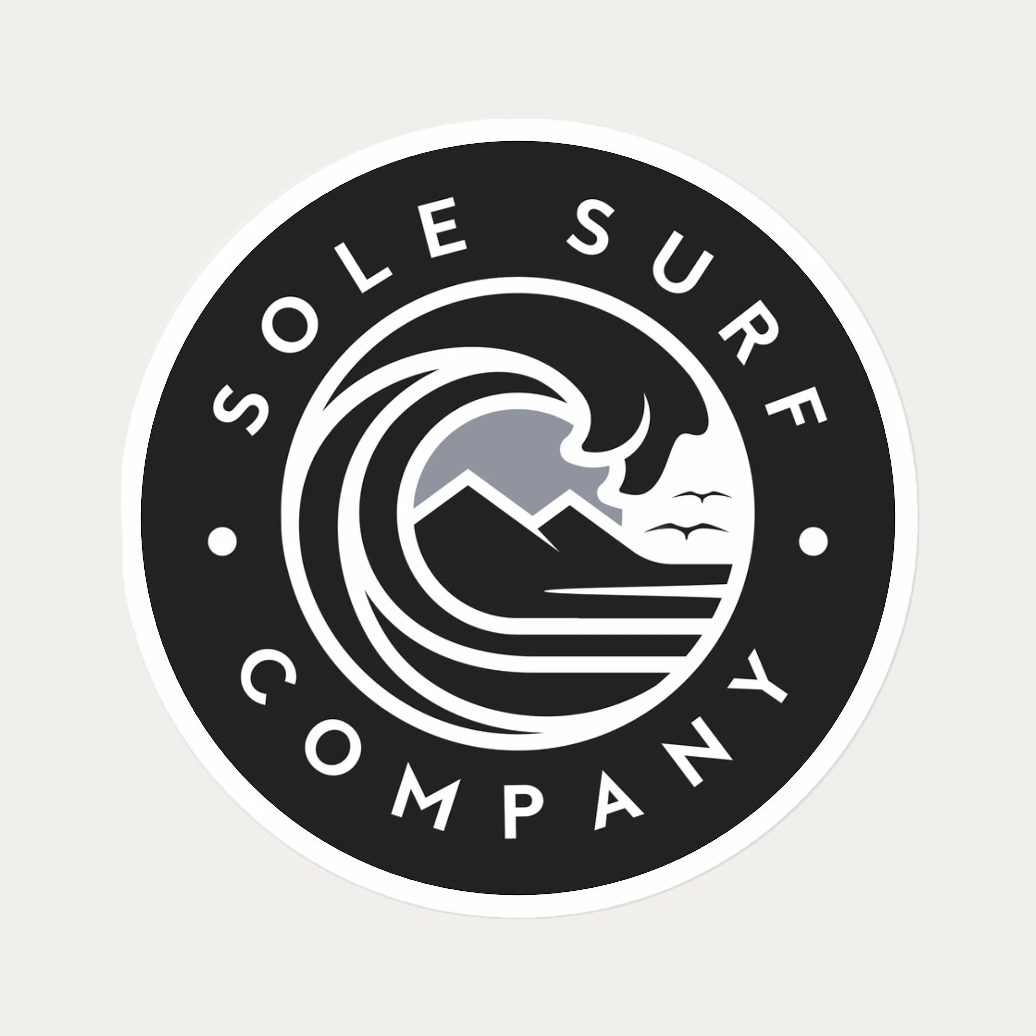 A circular black and white sticker or decal featuring the text 'SOLE SURF COMPANY' around a stylized wave and mountain graphic, shown on a plain white background.