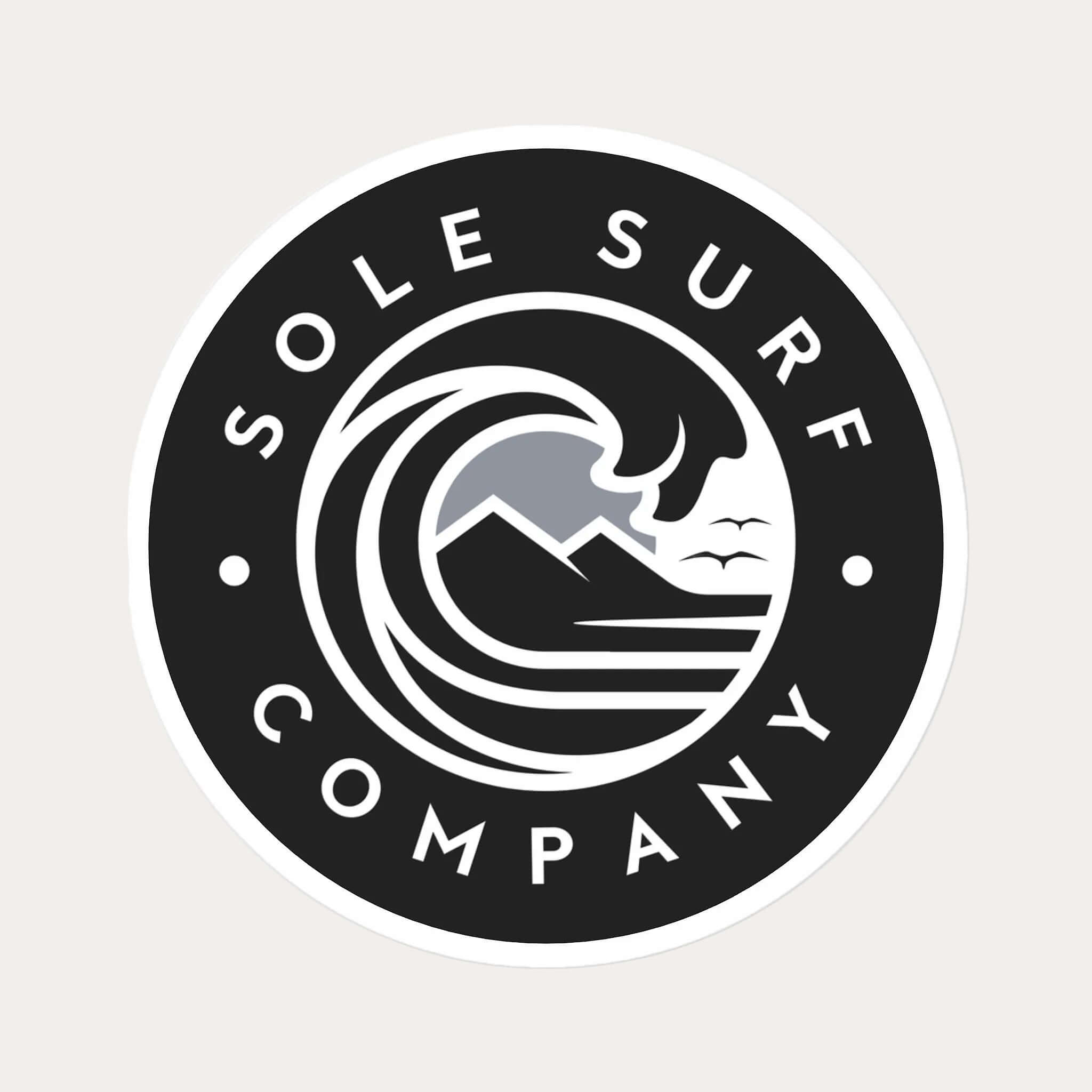 A circular black and white sticker or decal featuring the text 'SOLE SURF COMPANY' around a stylized wave and mountain graphic, shown on a plain white background.