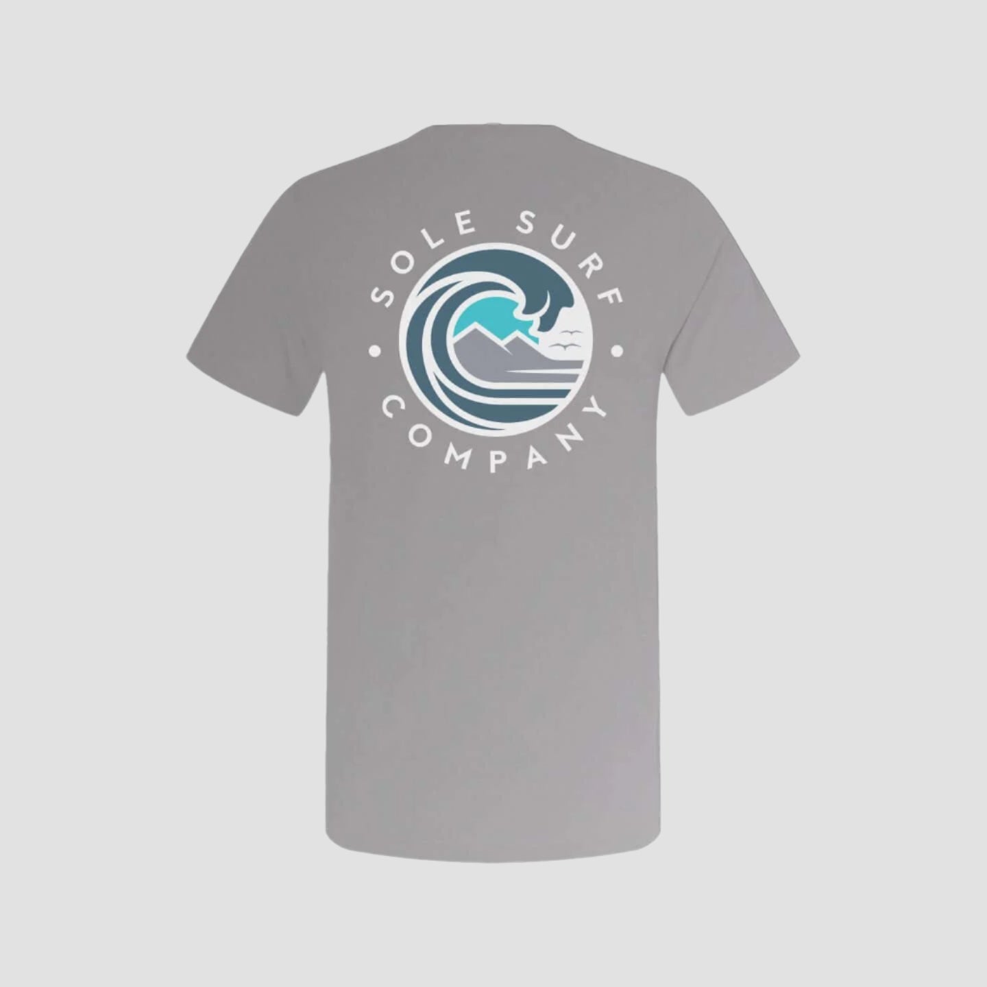 Grey t-shirt with Sole Surf Company logo featuring wave design, perfect for beach lovers and outdoor activities.
