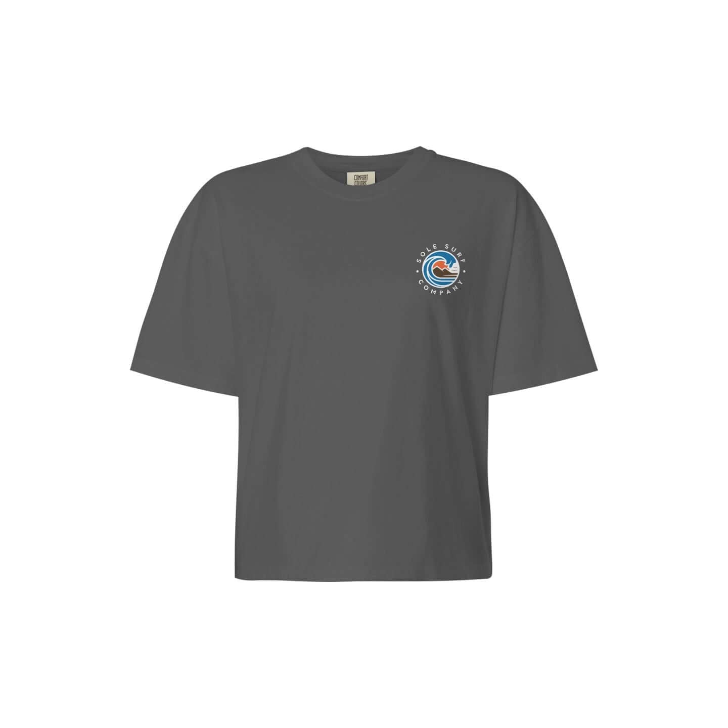 Women's boxy surf tee in vintage pigment dye gray, featuring a logo design, perfect for beach outings and casual wear.