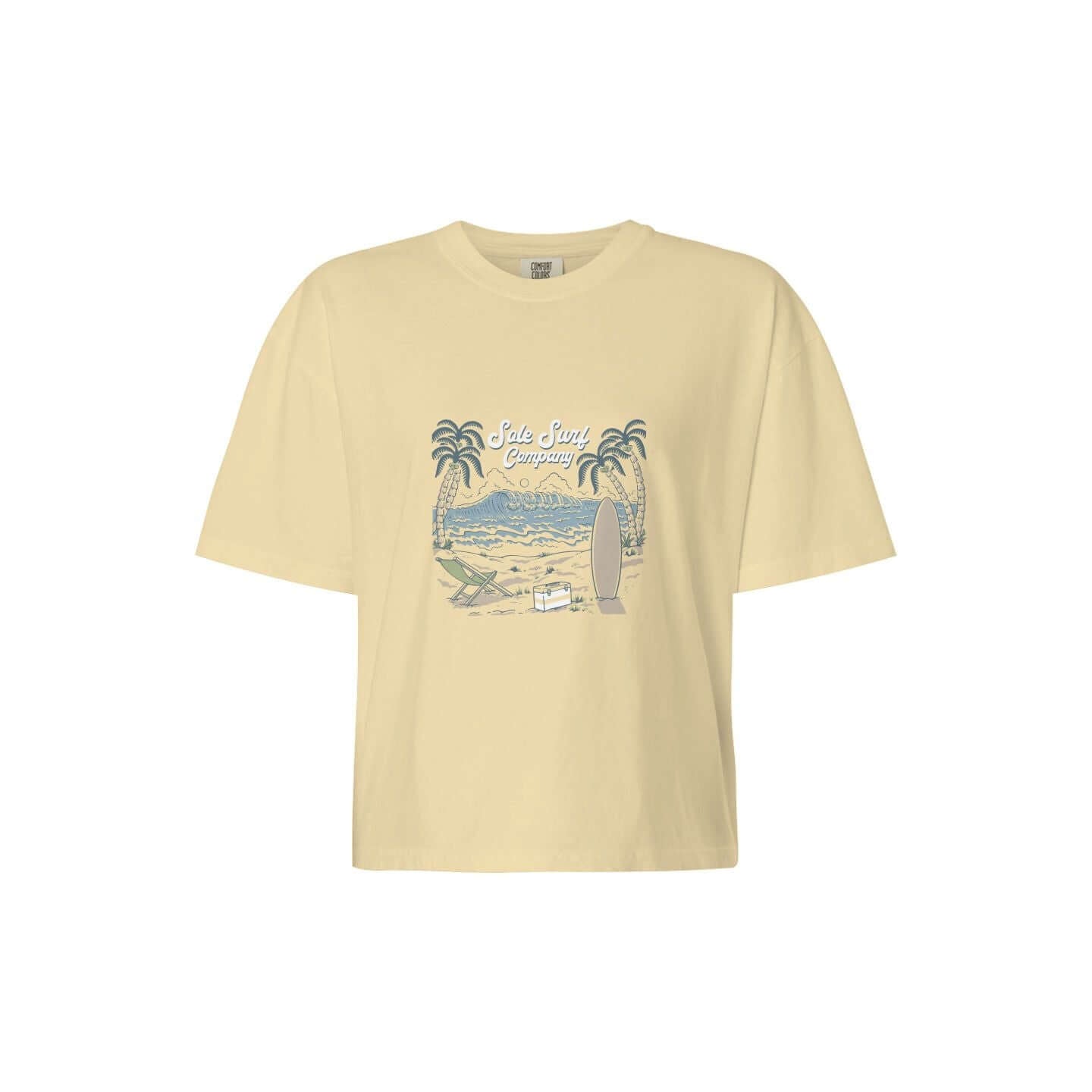 Women's Boxy Island Tee with a light yellow color and beach-inspired graphic design featuring palm trees and surfboards.