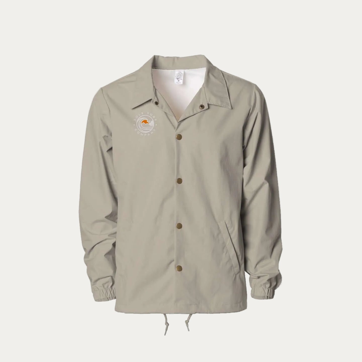 SSC Water Resistant Coaches Windbreaker in beige, ideal for surf checks and city strolls, lightweight and water-resistant.