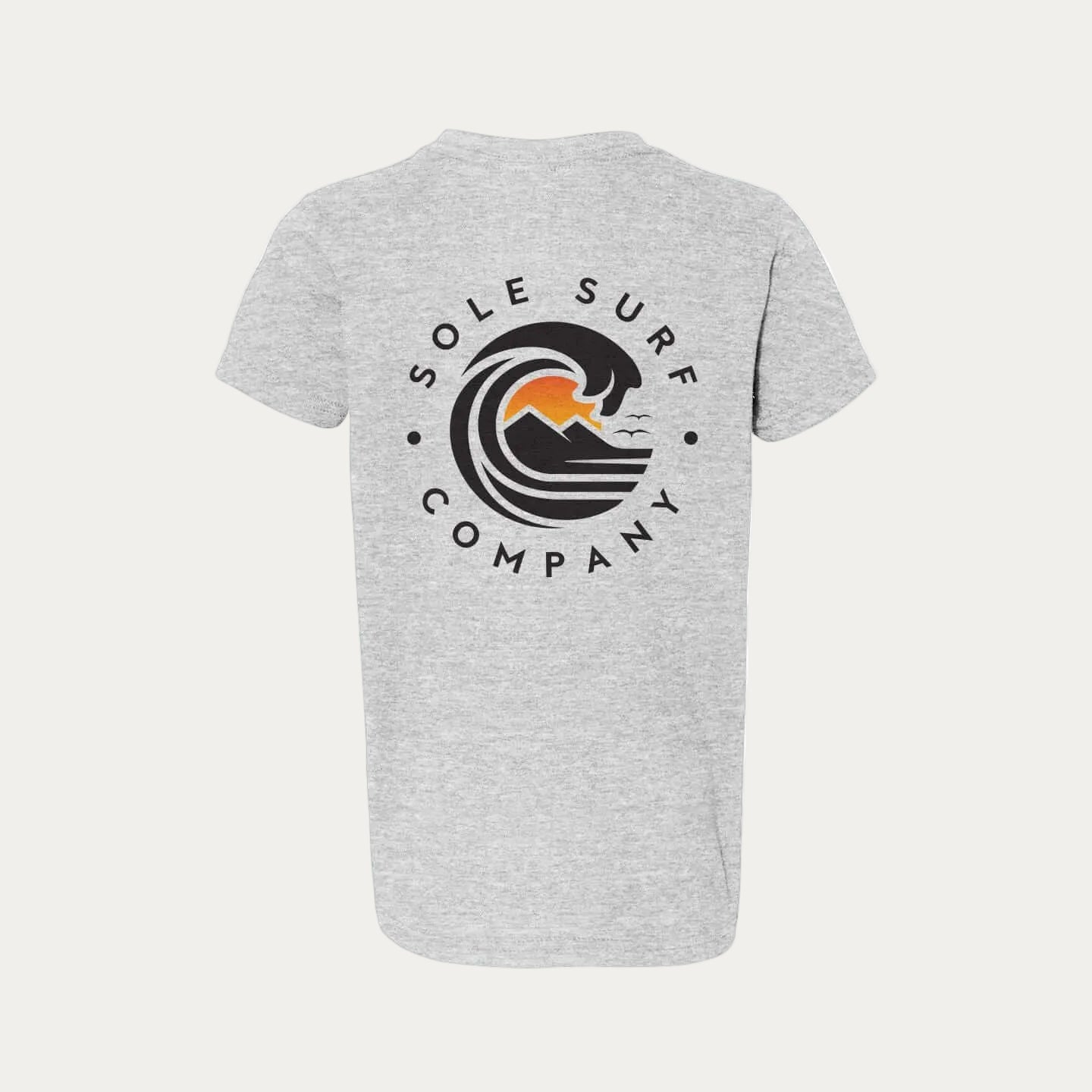 Kids Dark Logo Tee featuring the Sole Surf Company emblem on a gray youth tee.