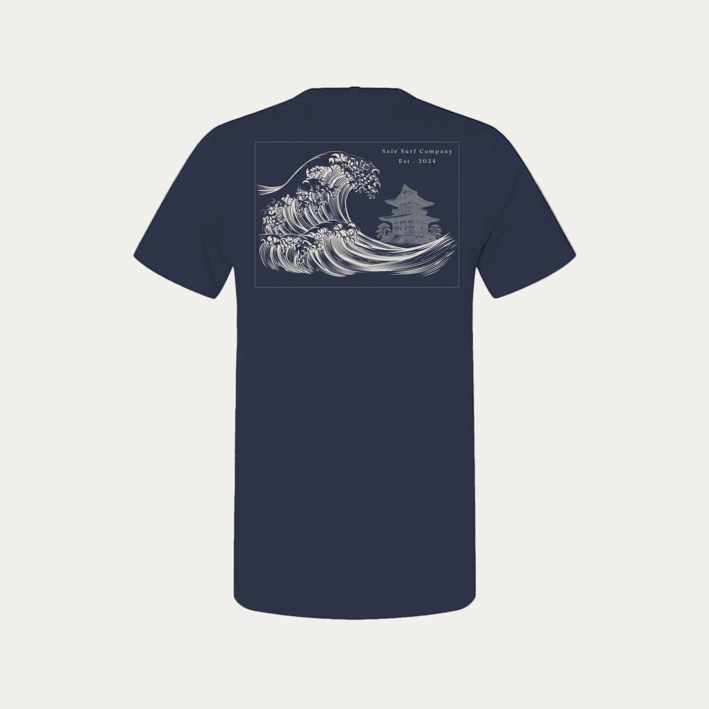 Tsunami Tee featuring traditional Japanese wave art on a navy background, embodying quiet power and respect.