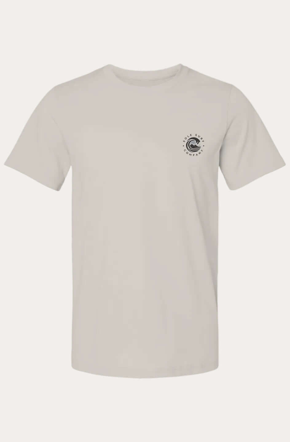 A light beige crewneck t-shirt with a small black circular graphic printed on the left chest, displayed against a solid off-white background.