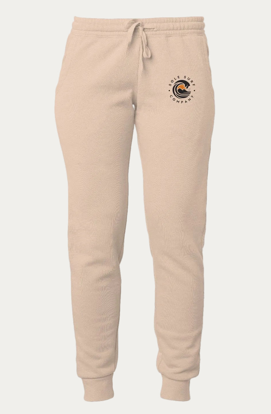 Beige fleece jogger pants with a drawstring waist and a circular 'Cedar Lake Township' logo printed on the left hip, shown against a plain white background. SCC Women's Orange Sun Sweatpants