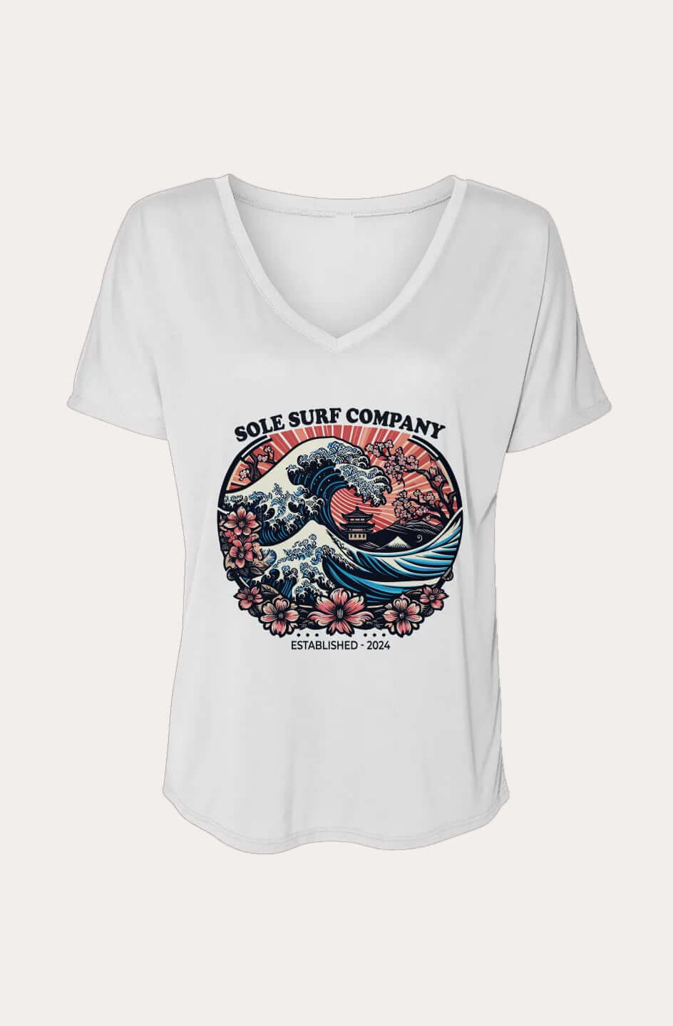 A white women's V-neck t-shirt with a colorful graphic print on the front. The graphic features the text 'SOLE SURF COMPANY' above a stylized wave illustration with pink flowers and a red sun, and 'ESTABLISHED 2024' below it.