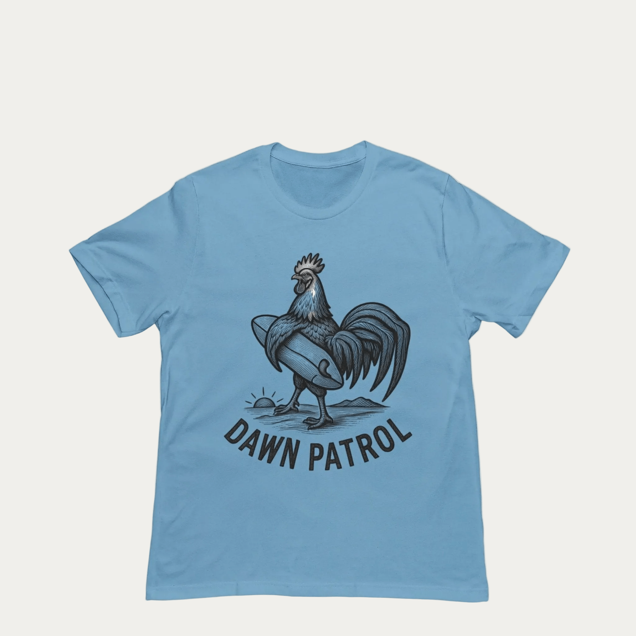 Blue t-shirt with a rooster graphic and 'Dawn Patrol' text on a yellow background