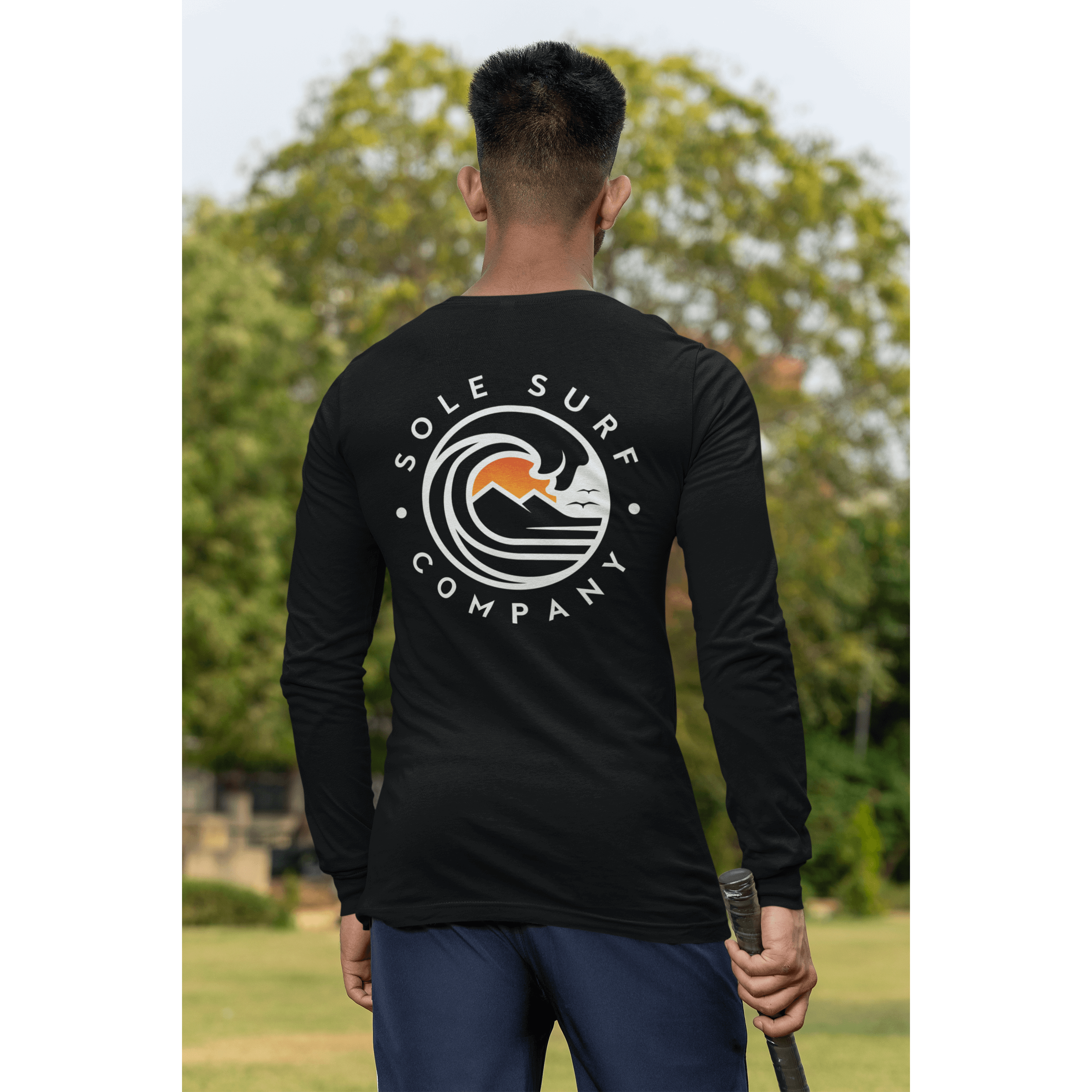 SSC White Logo Long Sleeve surf tee displayed from the back, showcasing the design with ocean waves and a laid-back vibe.