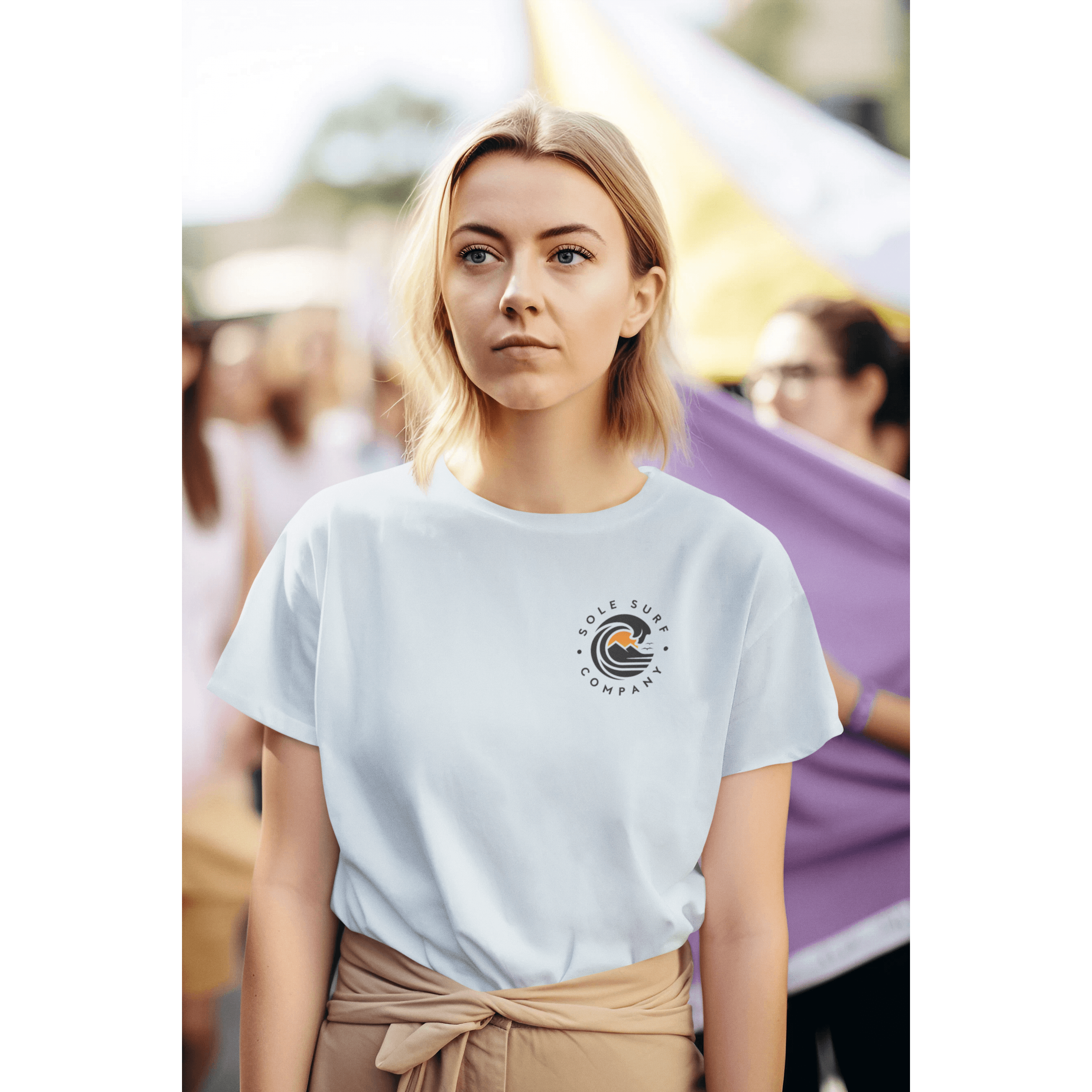 Model wearing a light blue tee with a logo, perfect for casual outings and stylish, comfortable everyday wear.