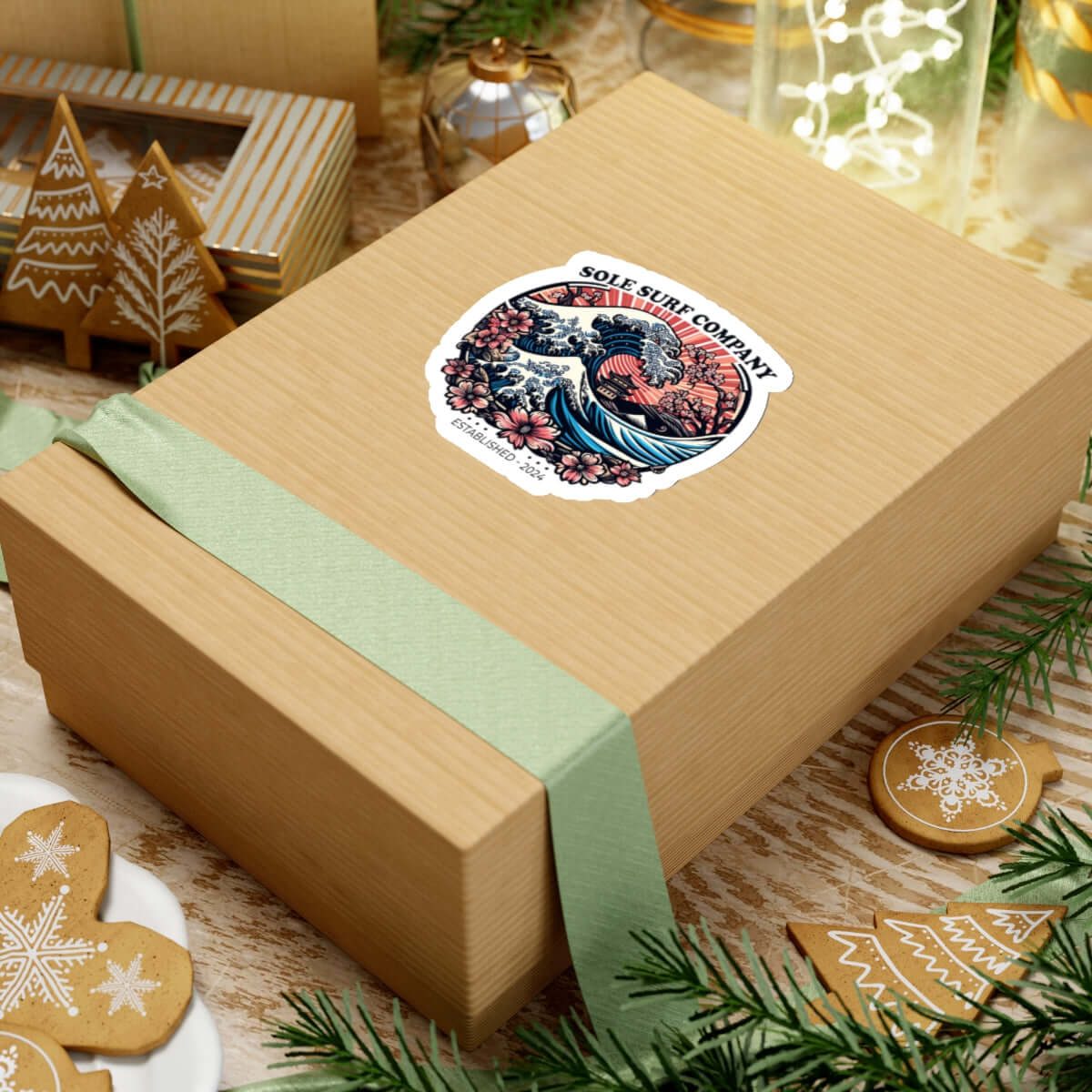 Beautiful Japanese wave sticker on a wrapped gift box, surrounded by festive decorations.