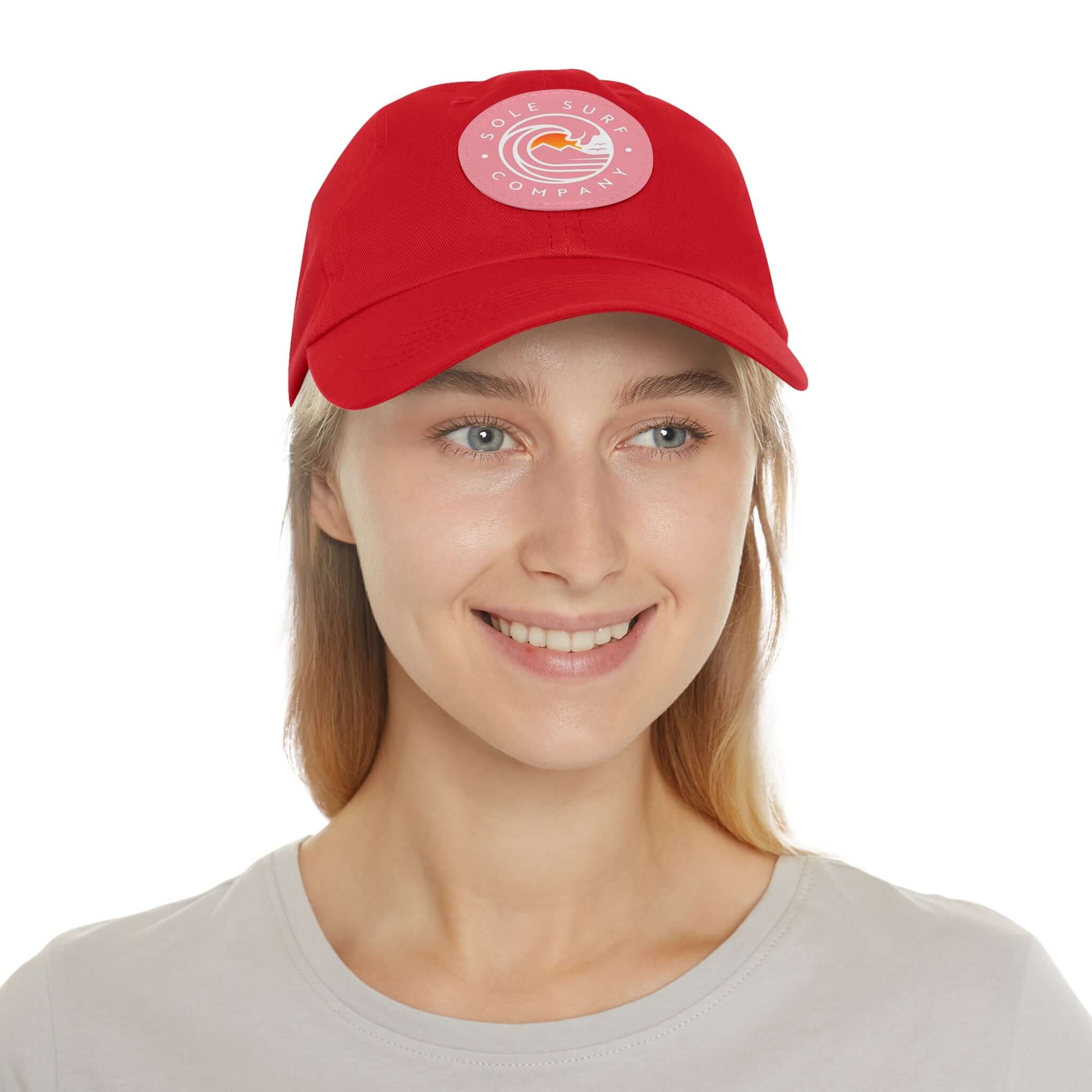 Mom Hat in red worn by a smiling woman, perfect for casual outings and stylish everyday wear.