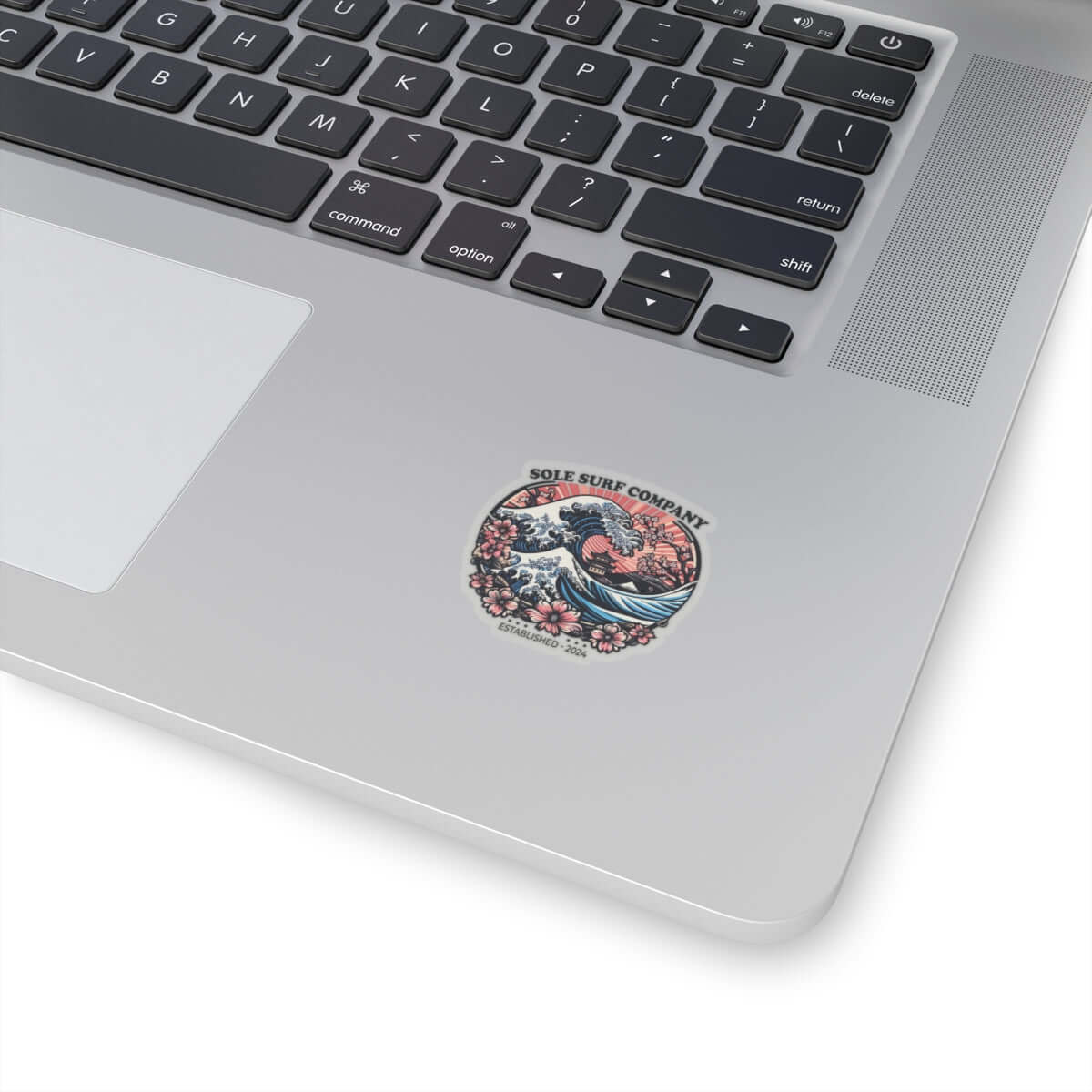 Vibrant Japanese sticker on a laptop, showcasing artistic design perfect for surf lovers and personalizing items.