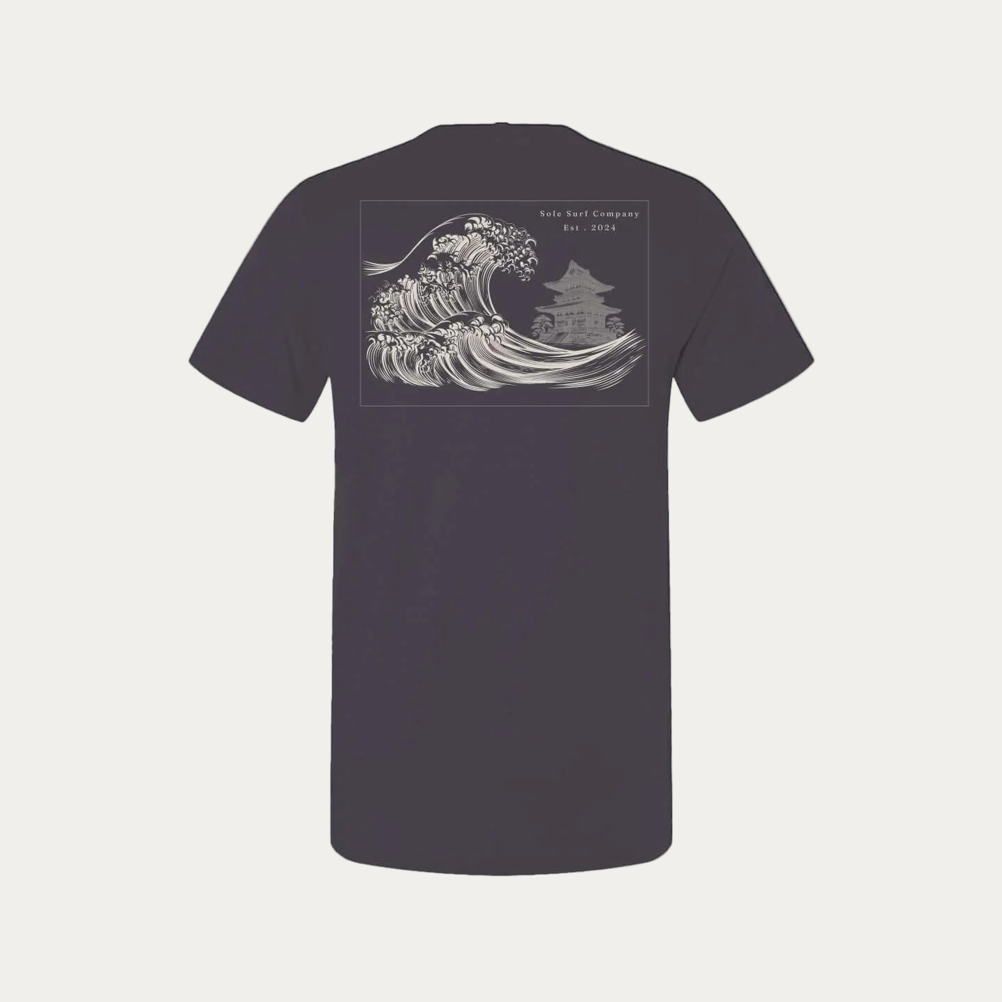 Tsunami Tee featuring traditional Japanese wave art on the back, showcasing quiet power and surf culture.