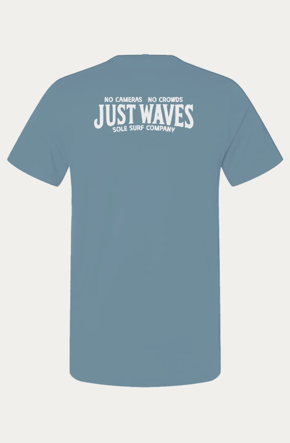 A dusty blue short-sleeve t-shirt shown from the back, featuring a white graphic print that reads 'NO CAMERAS NO CROWDS JUST WAVES SOLE SURF COMPANY'.