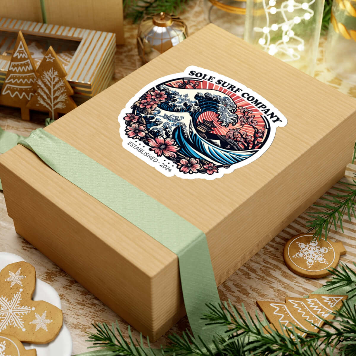 Vibrant Japanese picture sticker on a gift box with green ribbon, perfect for surf enthusiasts and artistic expression.