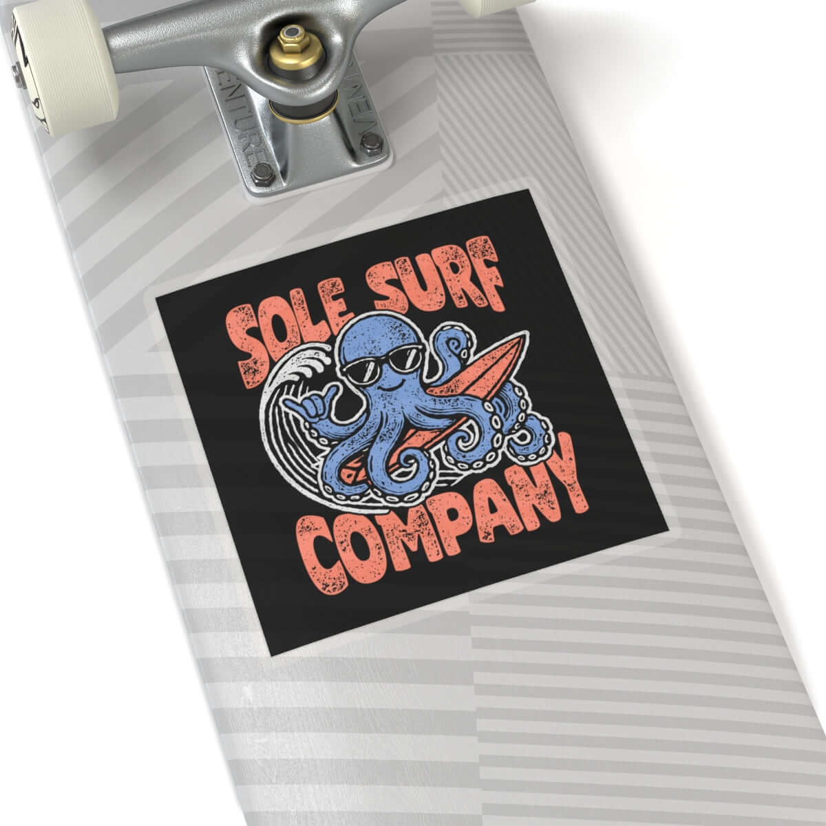 Colorful surfing octopus sticker on skateboard featuring Sole Surf Company logo.