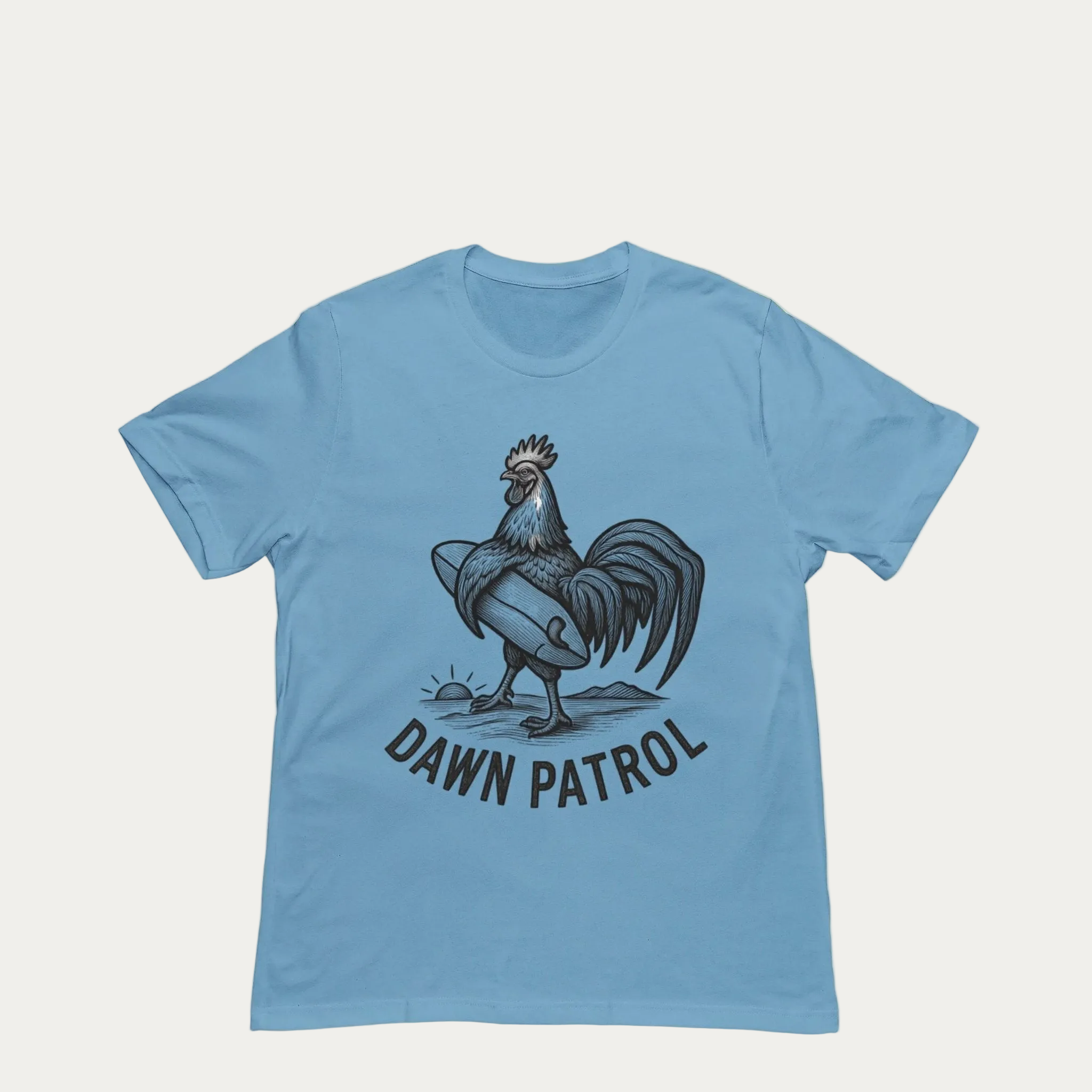 Blue t-shirt with a rooster graphic and 'Dawn Patrol' text on a yellow background